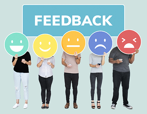 People showing customer feedback evaluation emoticons